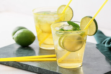 Cups of tasty cold ice tea on table
