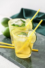 Cups of tasty cold ice tea on table