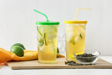 Fototapeta premium Glasses of tasty cold ice tea on table