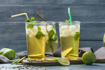 Glasses of tasty cold ice tea on table
