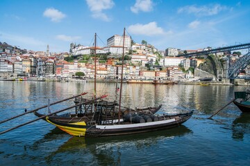 Fototapeta premium Porto city, Portugal. View of the river, with the boats and the city in the background