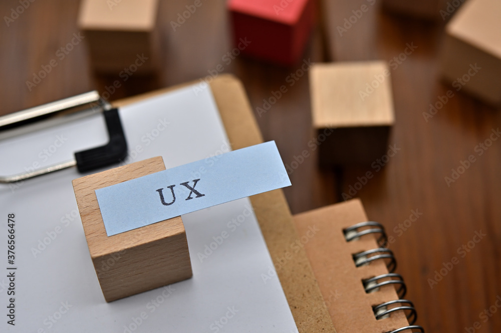 Poster a note with the user's persona written on it is placed on a clipboard along with a pen. a sticky not