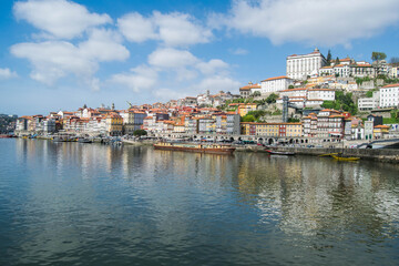 Naklejka na ściany i meble View of the city of Porto and the waterfront of the Douro river in Portugal