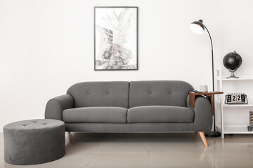 Armrest table on sofa in interior of room