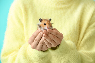 Woman with cute funny hamster, closeup