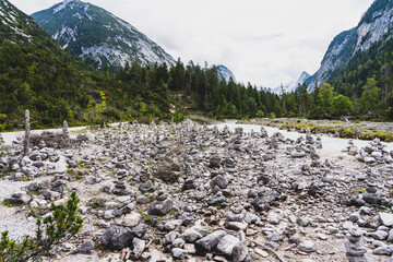 view on isar river and mountains near the isar origin in scharnitz, austria