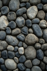Fototapeta na wymiar Stone background. Wall of rounded pebbles.