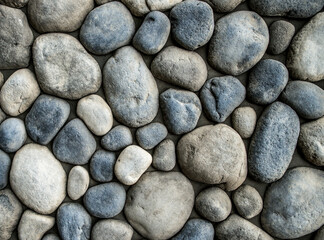 Stone background. Wall of rounded pebbles.