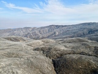 Fototapeta na wymiar Burnt mountain landscape with blue sky