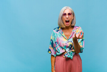 middle age cool woman looking angry, annoyed and frustrated screaming wtf or what‚Äôs wrong...