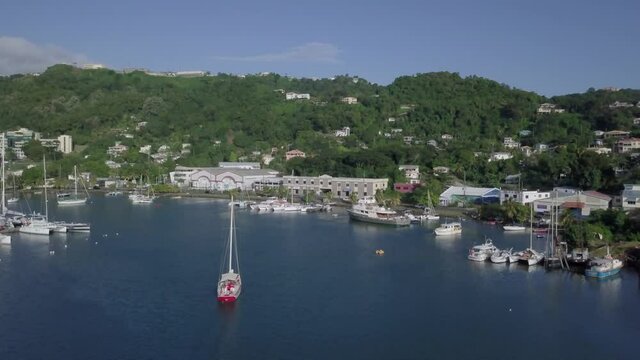 Traditional sloop boat sailing out the harbour, St. George's, Grenada