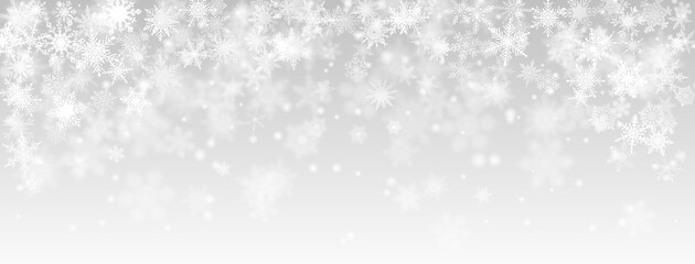 Christmas background of falling snowflakes in gray colors