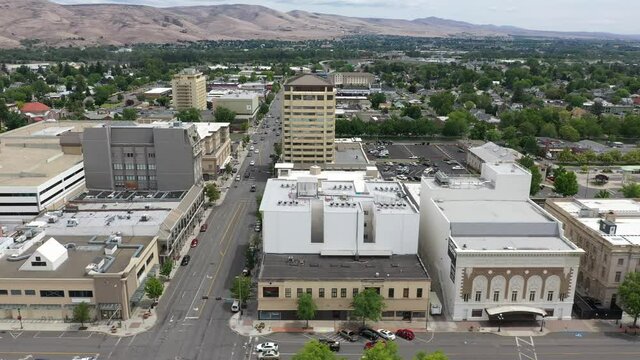 Drone footage of old historical buildings and contemporary businesses downtown Yakima, Washington