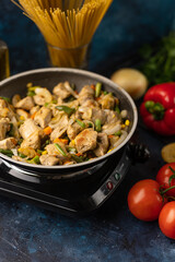 Roasting pork with vegetables, on the background of fresh ingredients and vegetables, culinary recipes