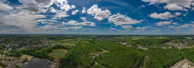 Obraz na płótnie Canvas Drone Panorama of the landscape of the German city with clouds on the blue sky