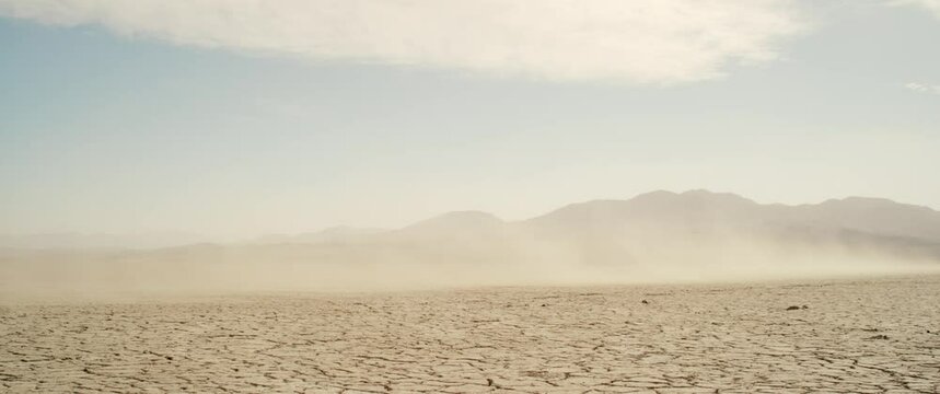 Dry lake motorcycle fly by 