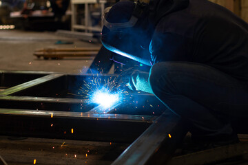 Metal workers use manual labor. Skilled welder.  Welder is welding the steel in the factory. welder...