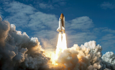 Spaceship takes off into the night sky on a mission. Rocket starts into space concept.Elements of...