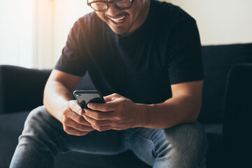 using cell phone.man hand holding texting message on screen mobile chatting,search internet...