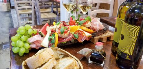 Selection of meats, cheeses, and wine in Italy
