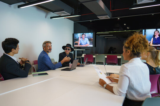 Diversity Business People Having Video Conference In Meeting Room