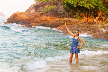 Woman happy with wave morning in Lonely Beach