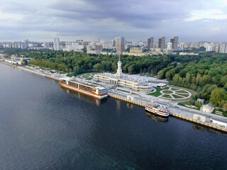 Aerial view is a beautiful panorama of the renovated Northern River Station in Moscow. Colorful landscape of the city and the river at sunset. River cruises