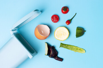 Organic waste and trash can on blue background, concept of garbage sorting