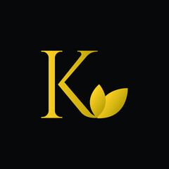 Initial Letter K Flourishes logo monogram in gold color and black background.