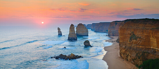 Sunset at the magnificent 12 Apostles, a series of
 limestone stacks off the shore of Port Campbell...