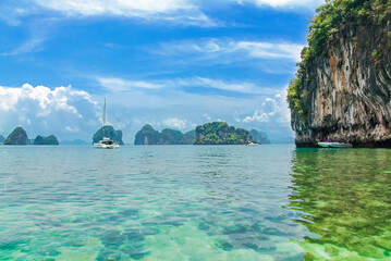Railay beach in Thailand, Krabi province,  view of tropical Railay and Pranang beaches with rocks and palm trees, coastline of Andaman sea  