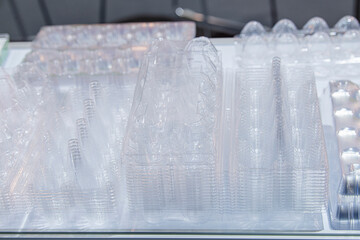 Stack of Clear plastic box for eggs. Selective focus