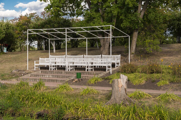 Wooden sofas for spectators on the lake