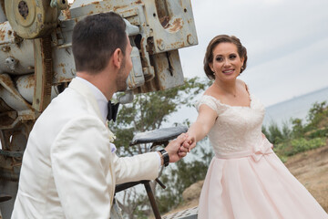 Naklejka premium Latino Bride and groom with white tuxedo 