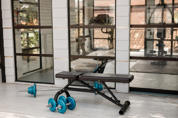 Close up of a bench in a gym. Sport, fitness, healthy lifestyle and bodybuilding concept