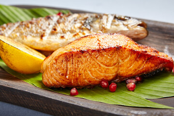 Fish served on wooden rustic plate