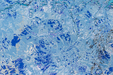 Clear and clean water in the blue swimming pool