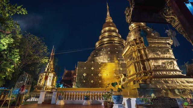 Lightning and thunderstorm over Wat Phra Singh Gold Temple at night, Chiang Mai