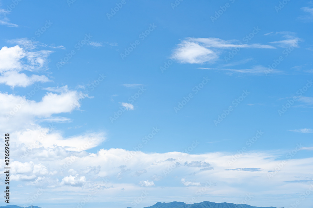 Wall mural Clear blue sky with white cloud background in the morning. Good weather background.