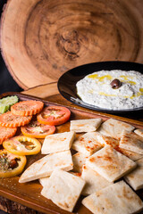 pitta bread served with a bowel of tzatziki