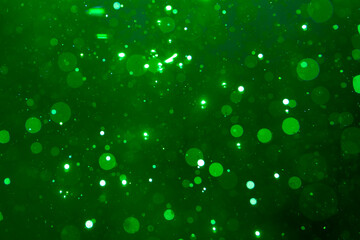 green bokeh on black background