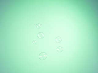 Soap bubbles on green background
