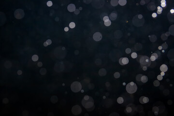 Fantasy bokeh sparkle from light on black