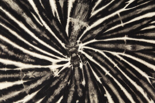black and white abstract spiral tie dye pattern.
