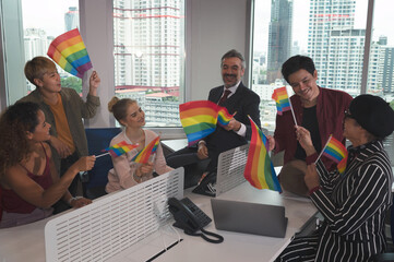 Group of business people with diverse genders (LGBT) celebrate LGBT freedom and support with LGBT...