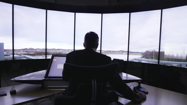 A row of windows light up with a view in an office