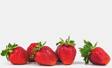 Ripe garden strawberry on a white isolated background copy space.