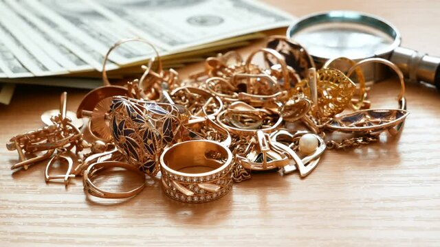 jewelry scrap of gold and silver and money, pawnshop concept ewerly inspect and verify