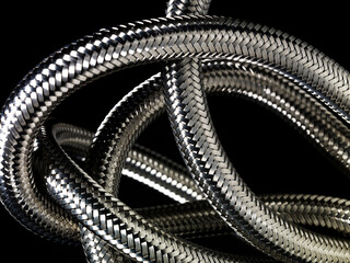 Obraz premium Metallic cable close-up on black background