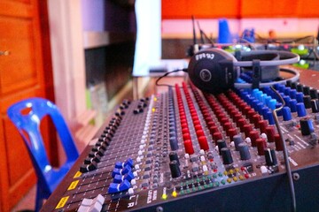 audio mixing console in recording studio